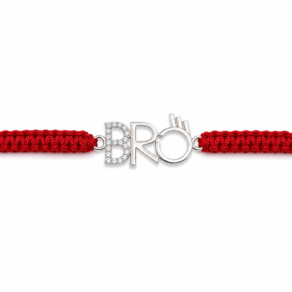 A red braided cord bracelet with a silver-tone central charm spelling 'BRO' in a stylized font, embellished with small clear stones on the letter B.