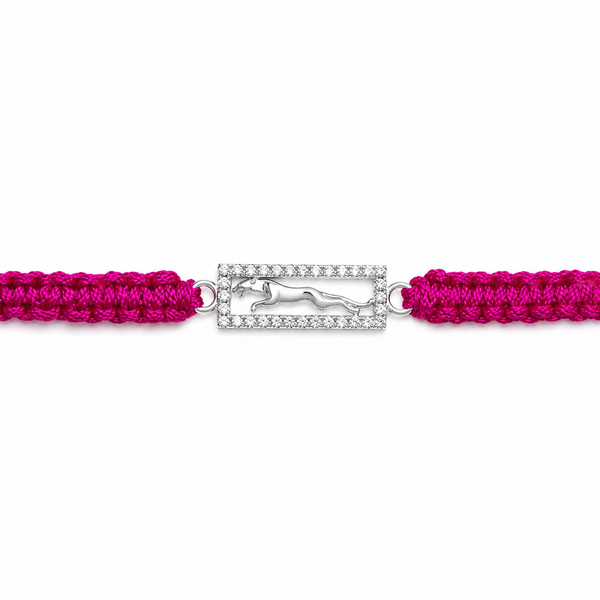 A magenta pink braided bracelet with a central silver-toned rectangular charm set with clear crystals and featuring a silver horse silhouette.