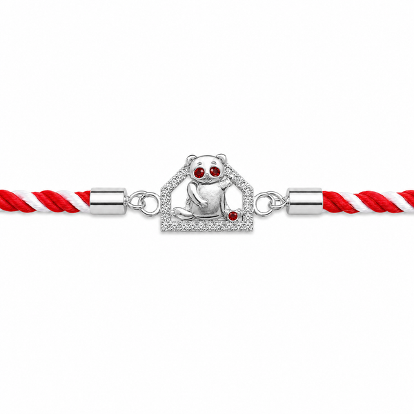 A silver-toned braided cord bracelet featuring a central charm of a panda sitting inside a diamond-encrusted house, with small red gemstone eyes and a red accent, flanked by red and white twisted cords on a white background.