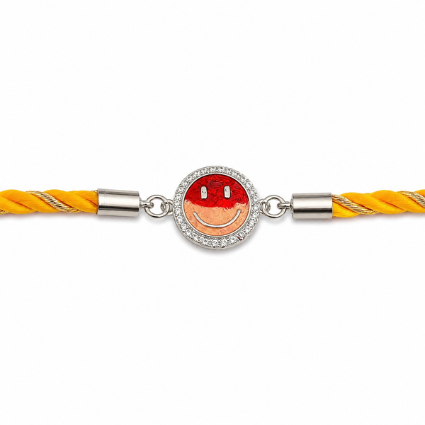 A yellow braided cord bracelet featuring a central silver-toned oval charm with a red and peach smiley face design surrounded by small clear stones.